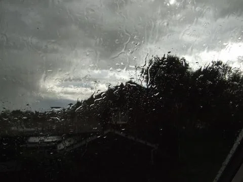Storm clouds seen through rain drops on a window Foto stock