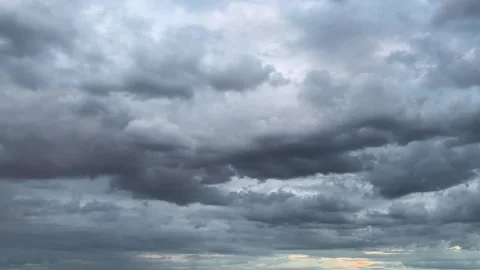 Storm clouds in the sky during sunset.	 Stock Footage 317362034