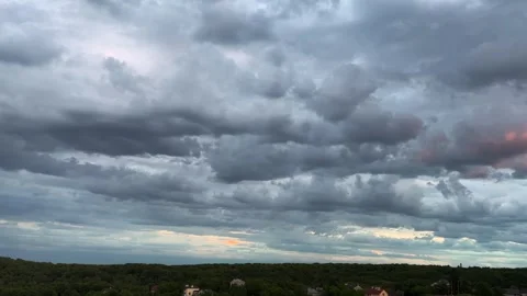 Storm clouds in the sky during sunset.	 Stock Footage 317363825