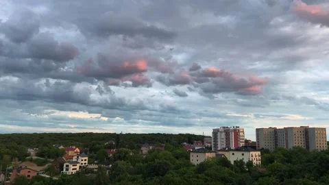 Storm clouds in the sky during sunset.	 Stock Footage 317367244