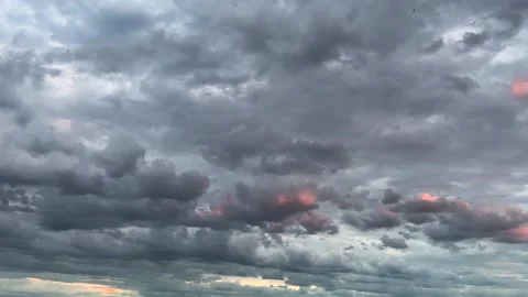 Storm clouds in the sky during sunset.	 Stock Footage 317371839