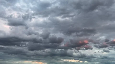 Storm clouds in the sky during sunset.	 Stock Footage 317371857
