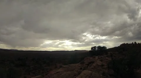 Storm clouds with sun rays timelapse over Arches National Park Video stock 11843499