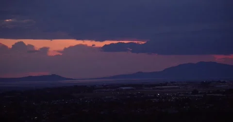 Storm clouds at sundown over the Great Salt Lake 動画素材 243620514