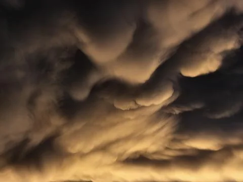 Storm clouds on sunset. Light in the dark and dramatic storm clouds. Background Foto stock
