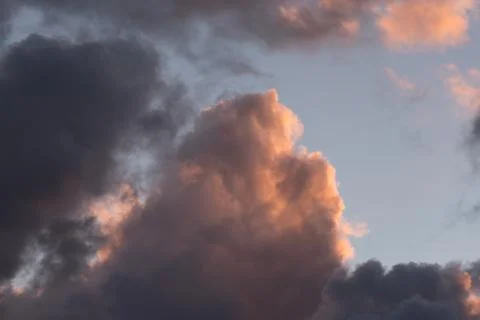 Storm clouds in the sunset light Stock Photos