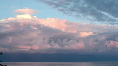 Storm clouds at sunset over a lake Stock Footage 76317946