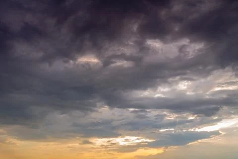 Storm clouds at sunset Stock Photos