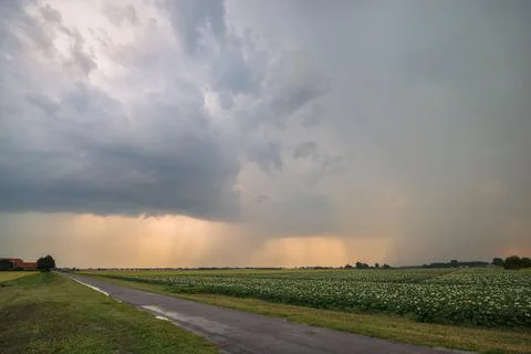 Storm clouds at sunset Stock Photos