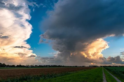 Storm clouds at sunset Stock Photos