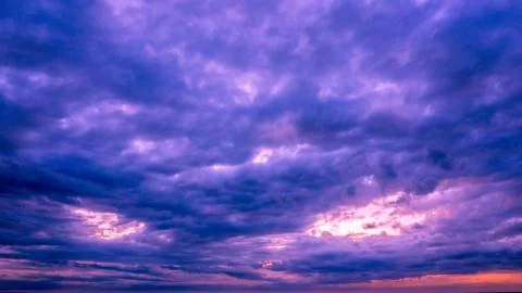 Storm clouds in the sunset time Stock Photos