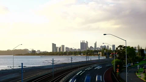 Storm clouds sweep across sky above freeway, river and city - timelapse Stock Footage 278949459