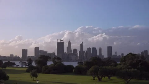 Storm clouds swirl above a windy Perth city viewed across Swan River. Stock Footage 134380979
