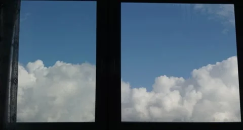 Storm Clouds Timelapse Through a Window Frame with Clear Blue Sky Stock-Footage 347744151