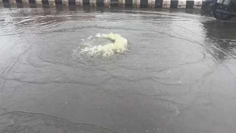 Storm Drain Overflow Flooding Urban Road During Heavy Rain 스톡 동영상 340499467