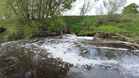 Storm Drain Water Flowing Into River Tees at Croft on Tees Uk Stock Footage 192865015