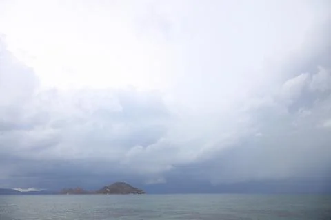 Storm dramatic clouds over the surface of the sea Fotos Stock