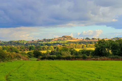 Before the storm - dramatic lighting on the farm with a stormy backdrop.  Vie Stock Photos