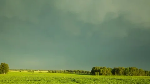 A storm during sunset, the appearance of a rainbow. Time laps landscape Stock Footage 80780011