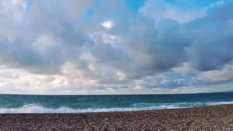 Storm-filled coastline with big waves and dramatic clouds Video stock 323254378