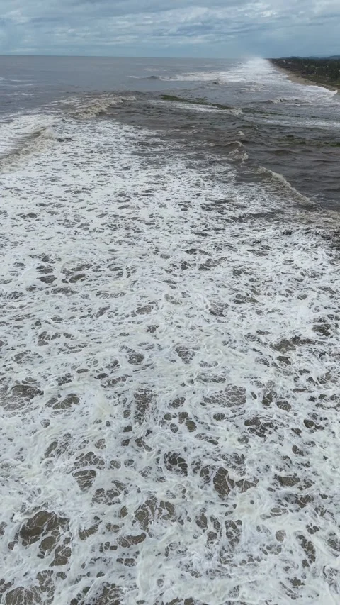 Storm foam patterns and dark swell from above, vertical aerial Acapulco Stock Footage 348300091