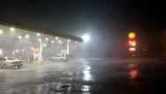 Storm Front With Blinding Rain Passes Over Gas Station Stock Footage