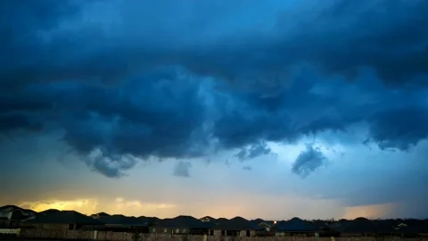 Storm front passes over a provincial town. Thunderstorm clouds with lightning. Stock Footage 219958011