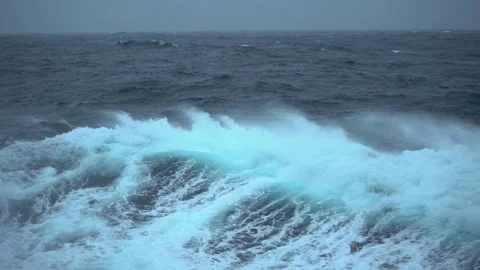 Storm. High waves. White foam on wind. Side view along ship. Wind breaks waves Stock Footage 204145769