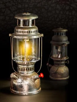 Storm lantern on dark background Stock Photos