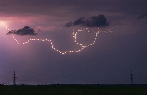 Storm, lightning strike in the horizon, thunder concept Stock Photos