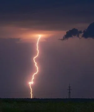 Storm, lightning strike in the horizon, thunder concept Stock Photos