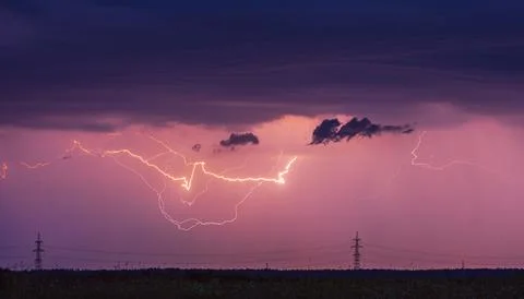 Storm, lightning strike in the horizon, thunder concept Stock Photos