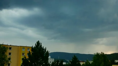 Storm with lightning strike over the hill behind the city. Stock Footage 200215791
