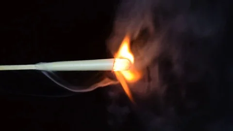 Storm match burns on a black background Stock Footage 76080736