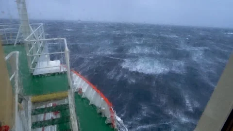 Storm in ocean. Navigation bridge of the ship is covered by a wave Stock Footage 263822086