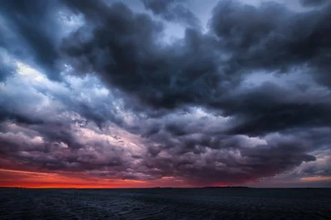 Storm on an ocean sunset Stock Photos