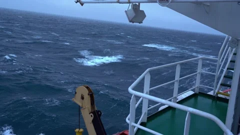 Storm. Ocean. Vessel. View from deck. Handrails, deck, stairs, life raft on Stock Footage 196391221