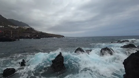 Storm in ocean waves clash of the rocks and water foam  near the shore Stock Footage 117148965