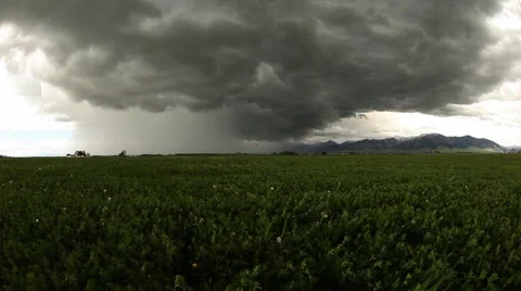 Storm over farm field Stock Footage 60793649