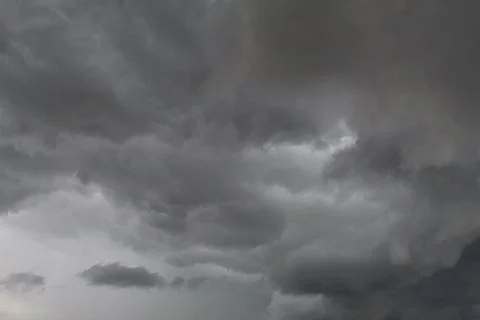 Storm over the field in summer Stock Photos