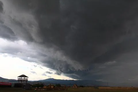 Storm over the field in summer Stock Photos