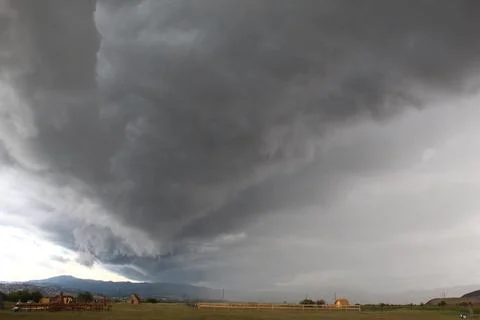 Storm over the field in summer Stock Photos