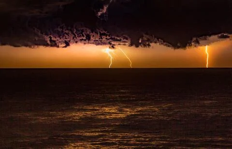 Storm over the ocean with lightning Stock Photos