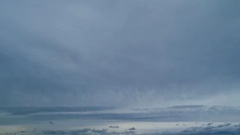 Storm overcast sky cloud scape. Dramatic cloudy rainy sky. Timelapse. Stock Photos