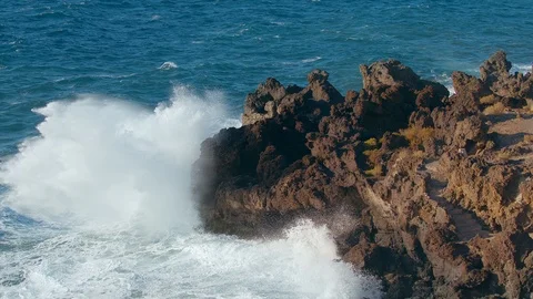 Storm in the Pacific Ocean Waves Break the rocks of the shore Water Foam Stock Footage 125810840