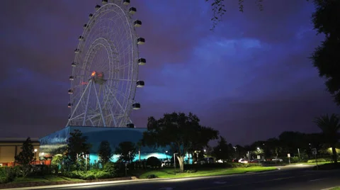 Storm passing behind a ferris wheel Stock Footage 64878931