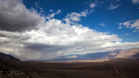 Storm Passing Over a Desert Valley Video stock 76632368