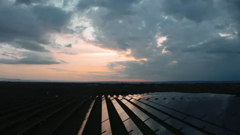 Storm Rain Clouds above Solar Panel Farm. Aerial drone view of Solar Panels  Stock Footage 154816232