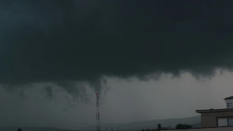 Storm rain clouds time lapse over small city, telecomunication tower view on the Stock Footage 108612000