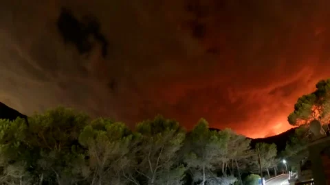 Storm with red clouds reflecting a Forest fire in Bejis, Spain Video stock 204950212